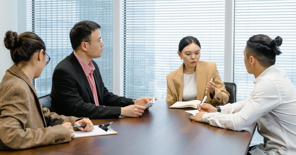 Group of colleagues collaborating in a modern office setting.
