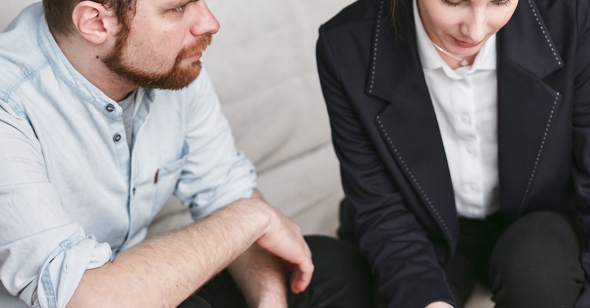 Business professionals in a meeting reviewing significant documents in an office setting.