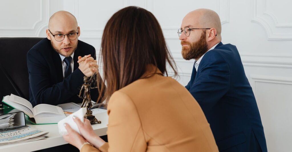 Professional discussion among lawyers in a modern office, focusing on legal matters.