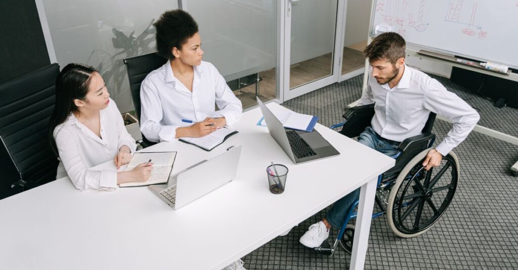 A diverse group of colleagues in a business meeting discussing ideas indoors.