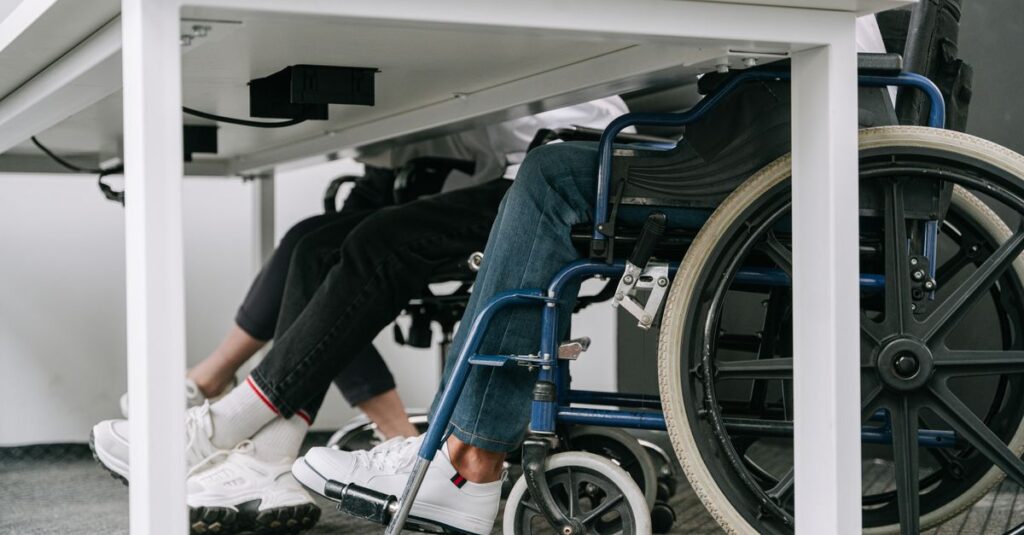 Business setting featuring people working with wheelchair accessibility indoors.