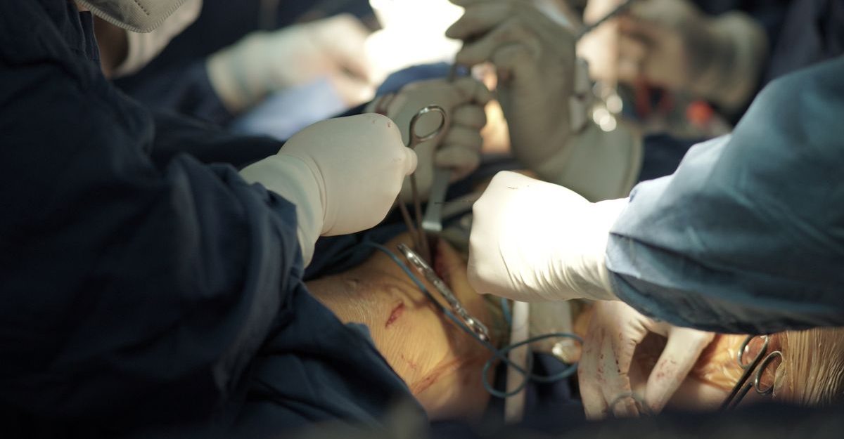 Team of surgeons executing a delicate surgical procedure in an operating room.
