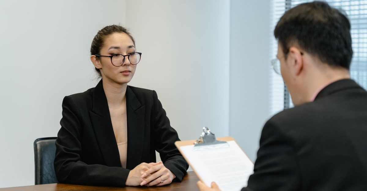 Business interview scene with professionals in office setting.